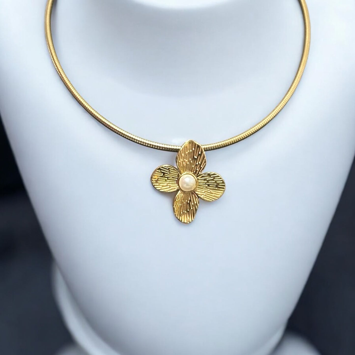 Elegant Anti-Tarnish Flower Necklace with a gold-tone floral pendant and pearl centerpiece on a sleek gold chain.