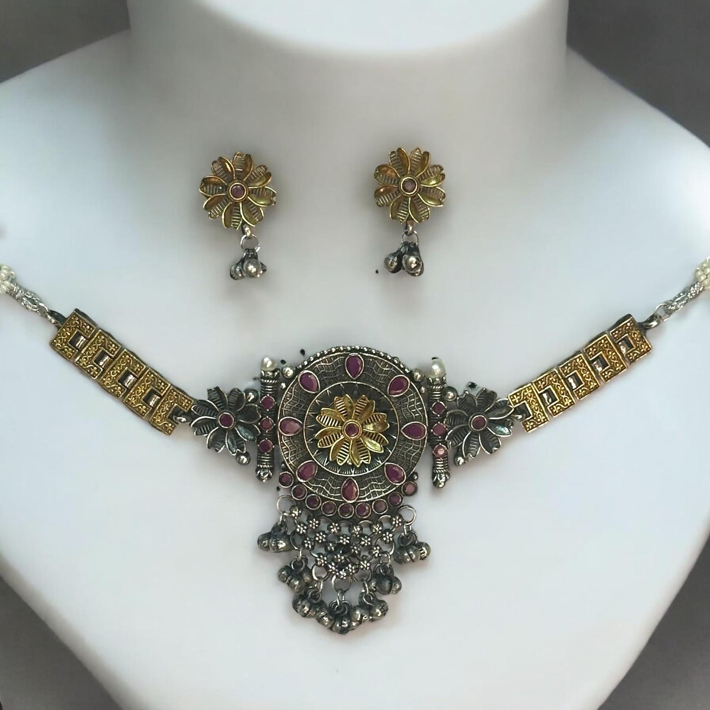 Dual Tone Silver Replica Choker Set with Gold Tone Detailing and Floral Motif Design, Paired with Matching Earrings.