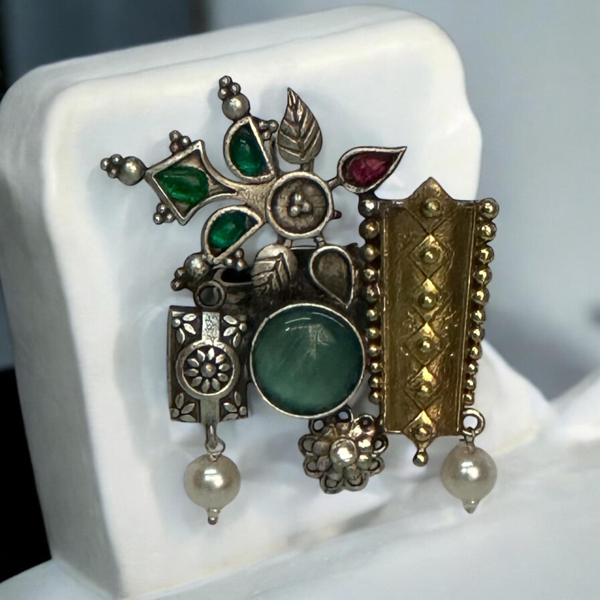 Fusion Designer Finger Ring with a mix of gold-plated and oxidized silver motifs, featuring green and red stones, floral designs, and pearl drops, displayed on a white background.