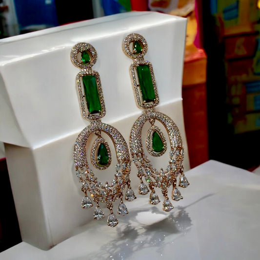 Green American Diamond Statement Earrings on a white colored jewellery display stand