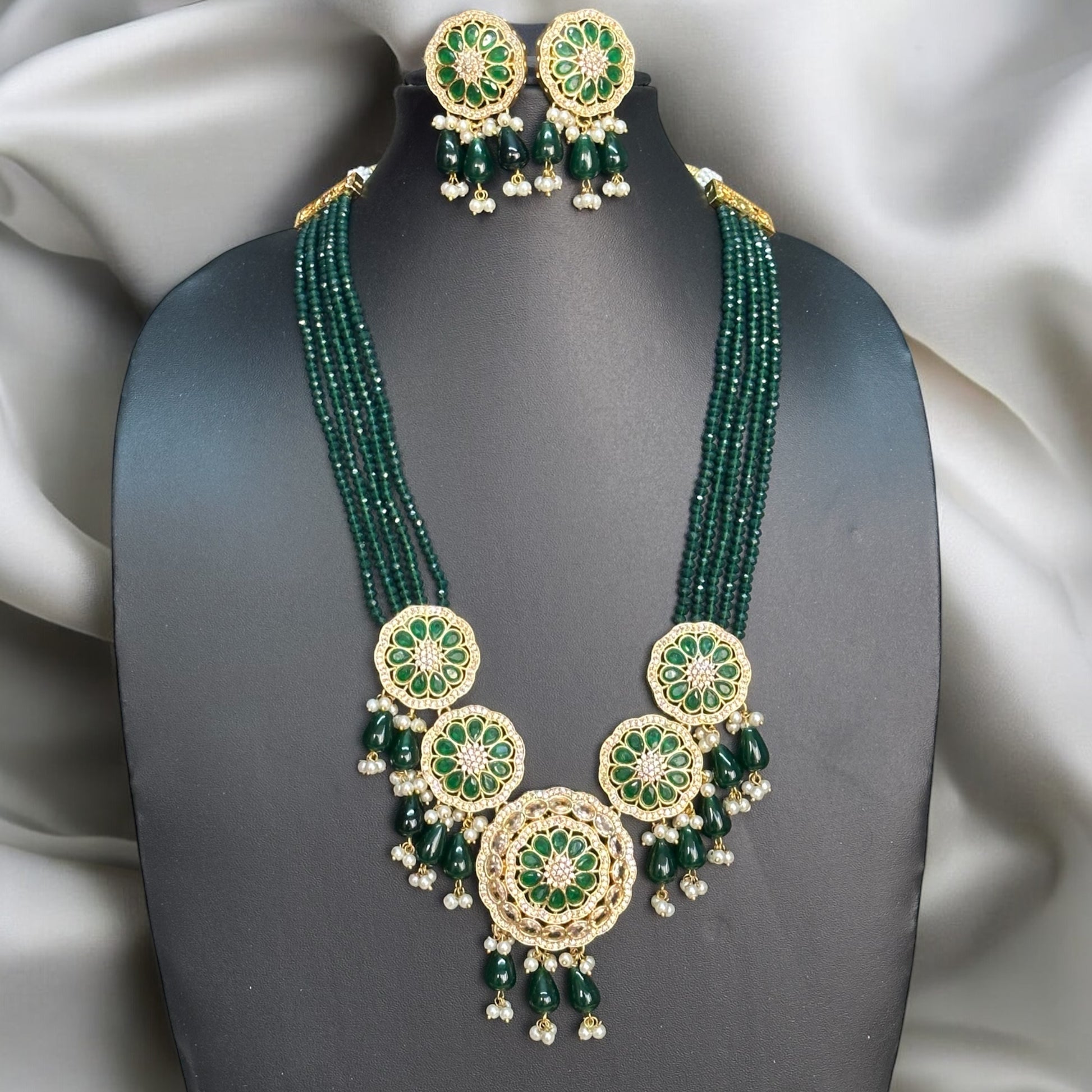 Kundan Pearl Green Necklace Set with Earrings – multi-layered green beaded necklace with gold-tone kundan work, pearl accents, matching earrings. Perfect for weddings and festive occasions.