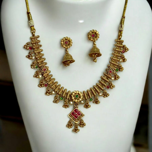 Premium Rajwadi Kundan Necklace Set with Earrings – Traditional Indian Jewelry Set featuring intricate gold-tone detailing, colorful kundan stones, and an elegant pendant design. Perfect for weddings, festive occasions, and ethnic wear styling. Includes matching jhumka earrings for a complete royal look.