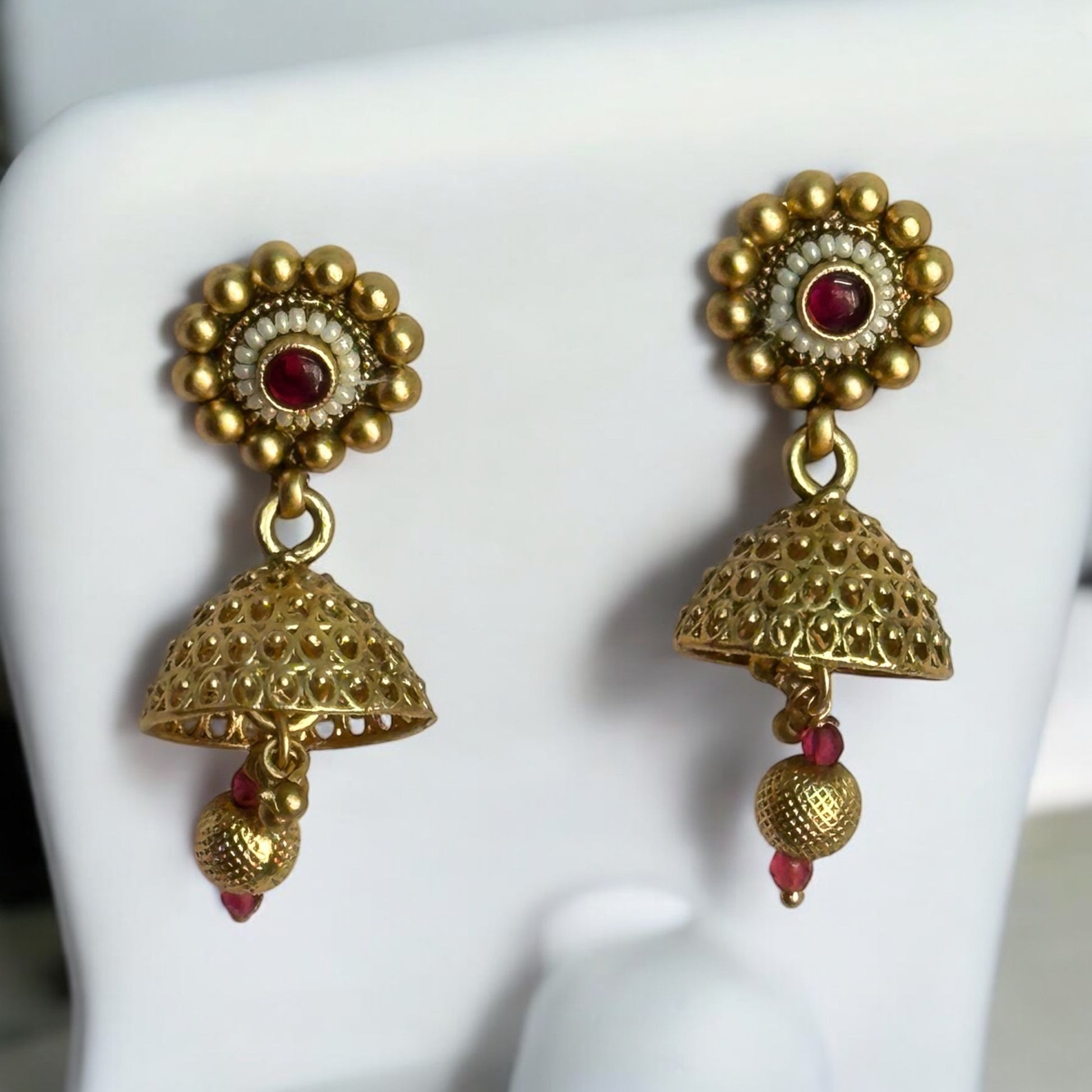 Exquisite Kundan Premium Rajwadi Necklace sets' jhumka earrings with intricate gold detailing featuring regal red accents.