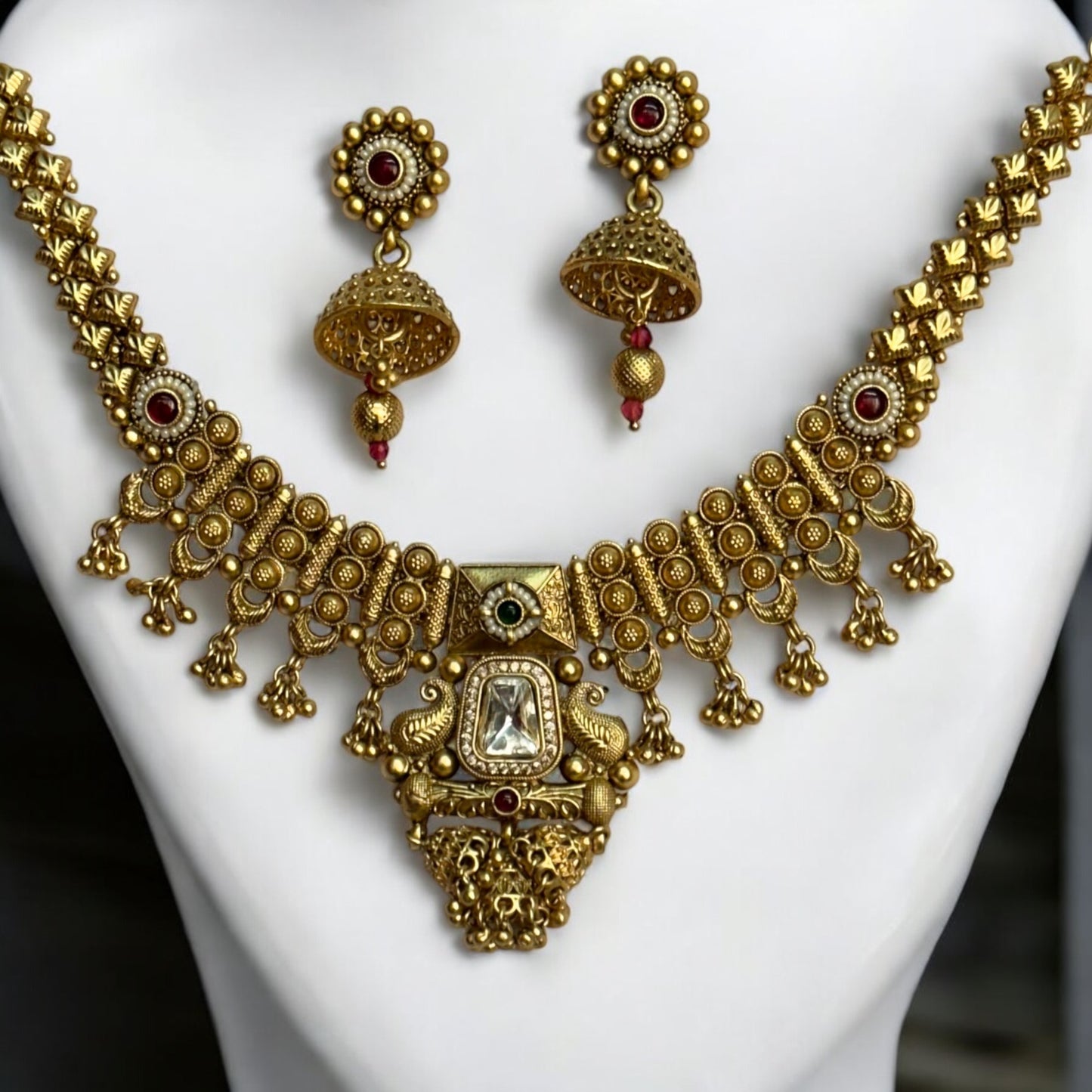 Exquisite Kundan Premium Rajwadi Necklace with intricate gold detailing and matching jhumka earrings, featuring regal red accents.