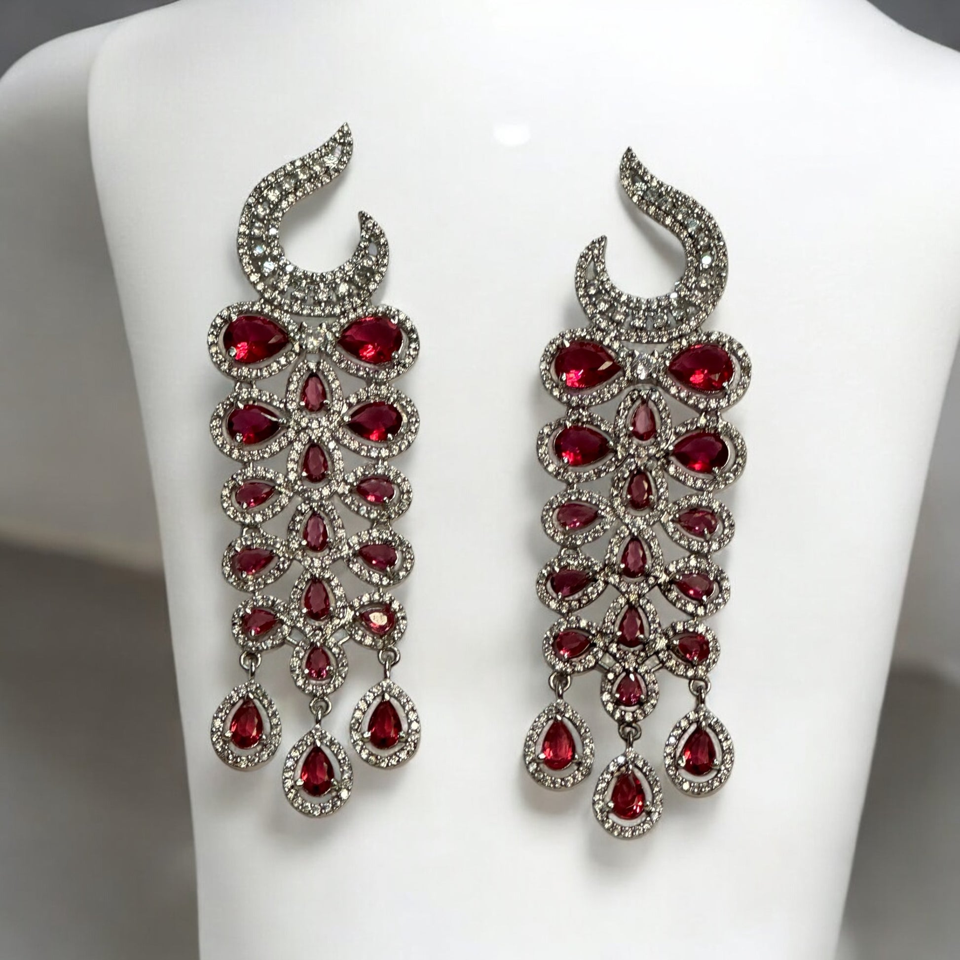 Statement Partywear American Diamond Earrings – stunning cascade earrings with sparkling American diamonds and ruby-red stones. Perfect for weddings, cocktail parties, and festive events.