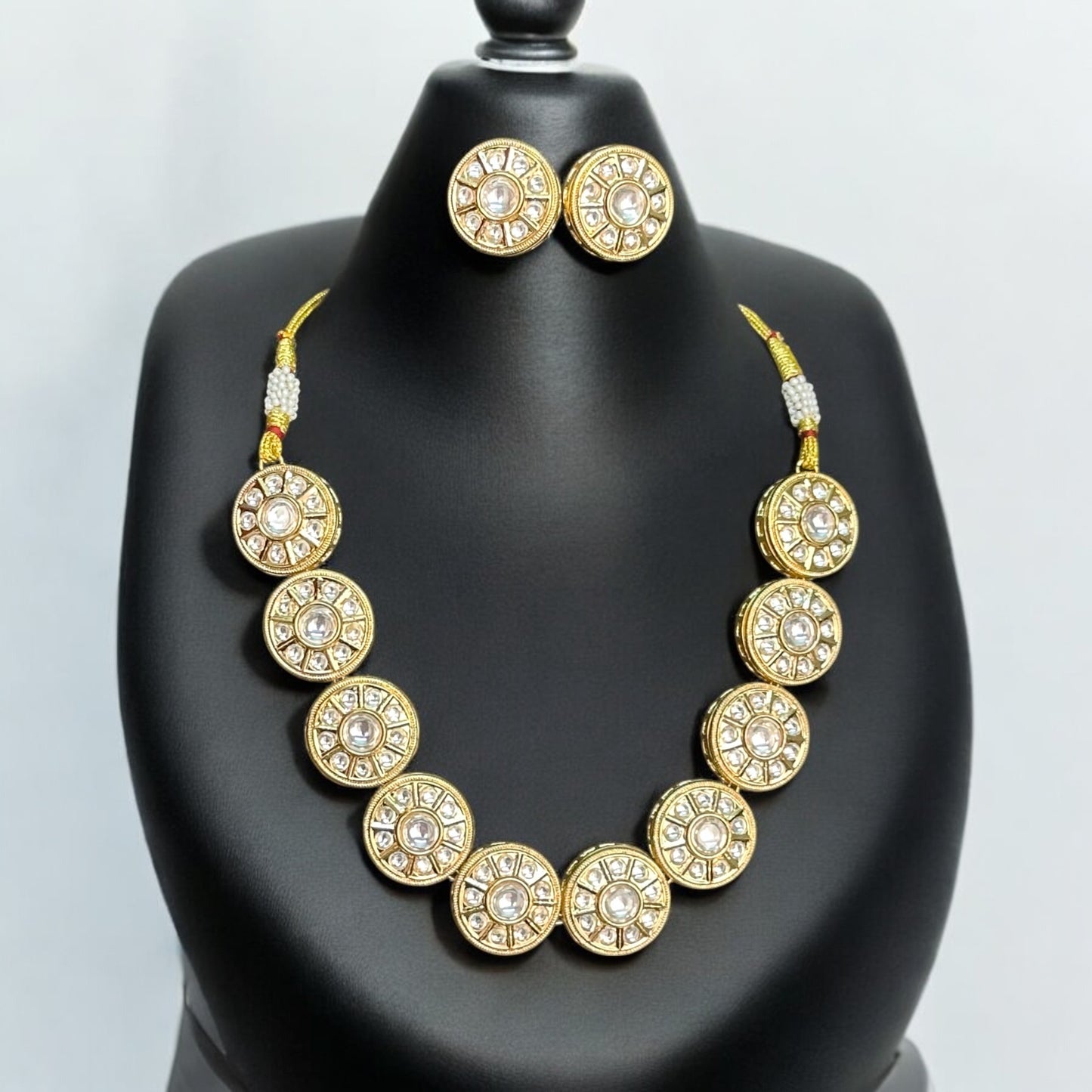 Statement Polki Kundan Choker Necklace with Studs – gold-tone choker featuring circular motifs with polki and kundan accents, paired with matching round stud earrings. Perfect for grand celebrations.